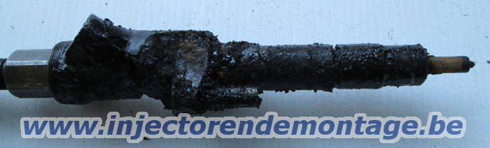 Removed injector flooded with black glop from
                axhaust gasses
